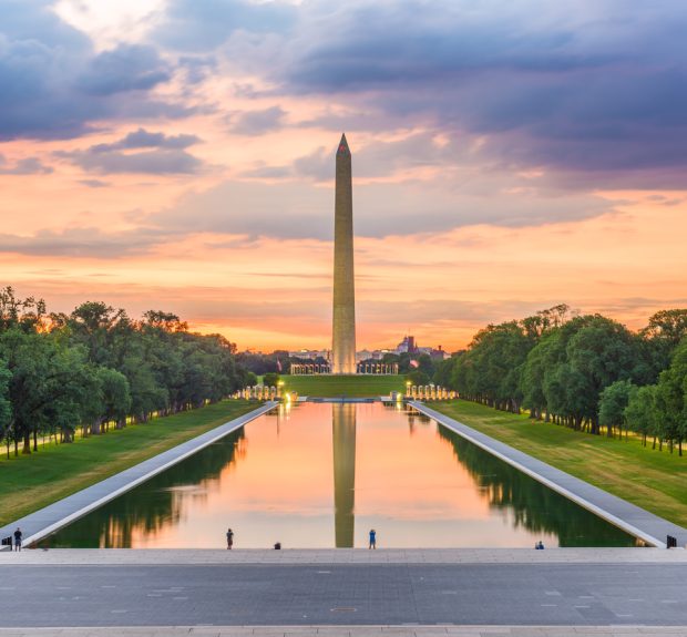 Washington DC, USA Washington Monument on the Reflecting Pool in Washington, D.C. at dawn.