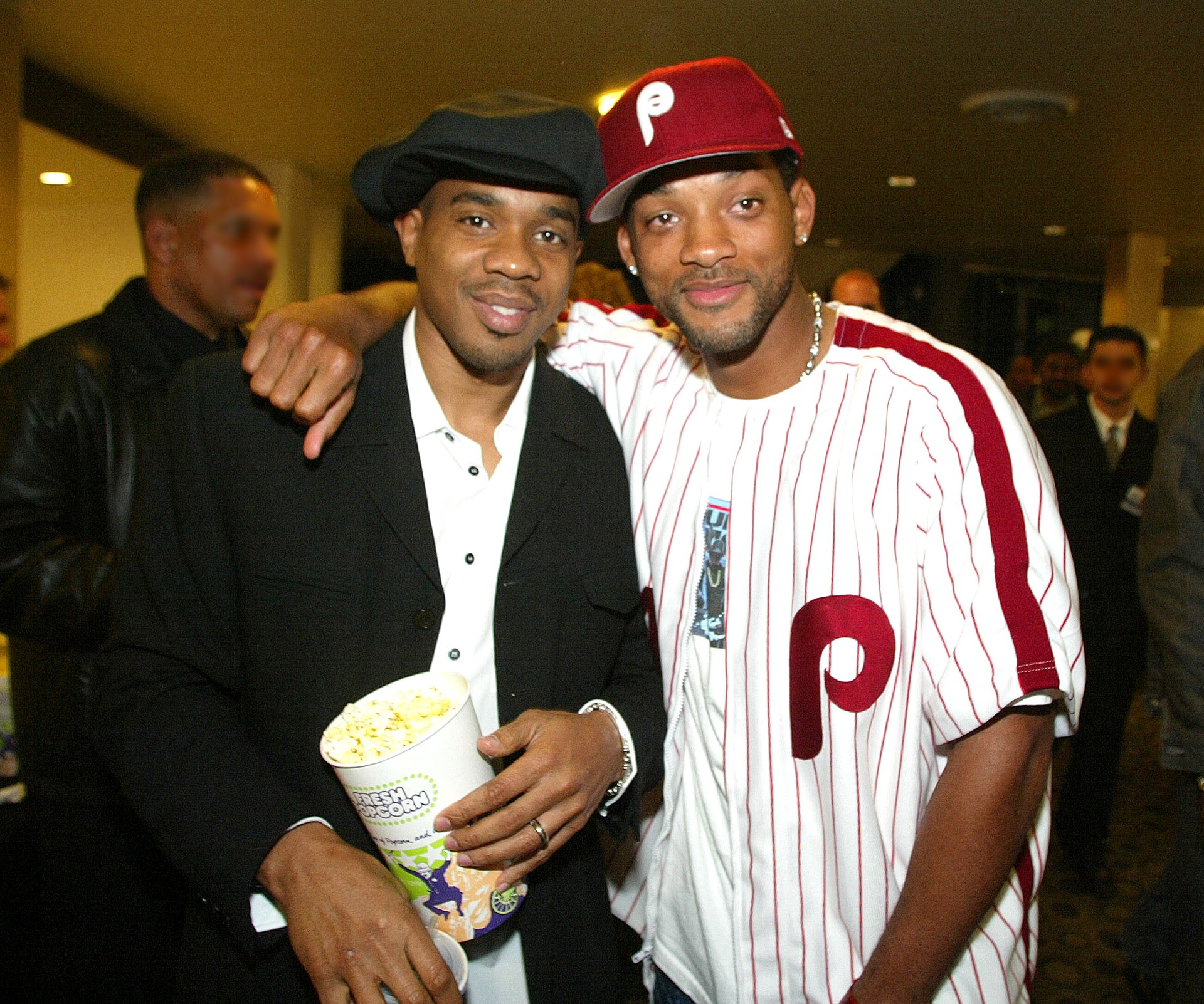 Actors Duane Martin (L) and Will Smith pose with his arm slung around Martin's neck at the premiere of "Deliver Us From Eva" at the Cinerama Dome and after-party at the Sunset Room on January 29, 2003 in Hollywood, California.